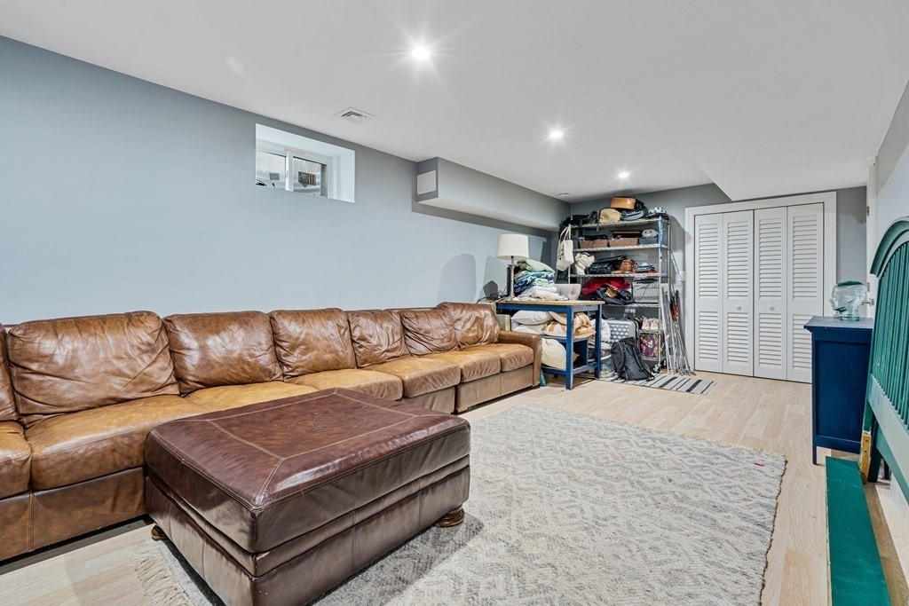 8 Loring Place, Unit 8 Boston, MA 02136 - Photo 17 of 23 a living room with furniture a couch and potted plant