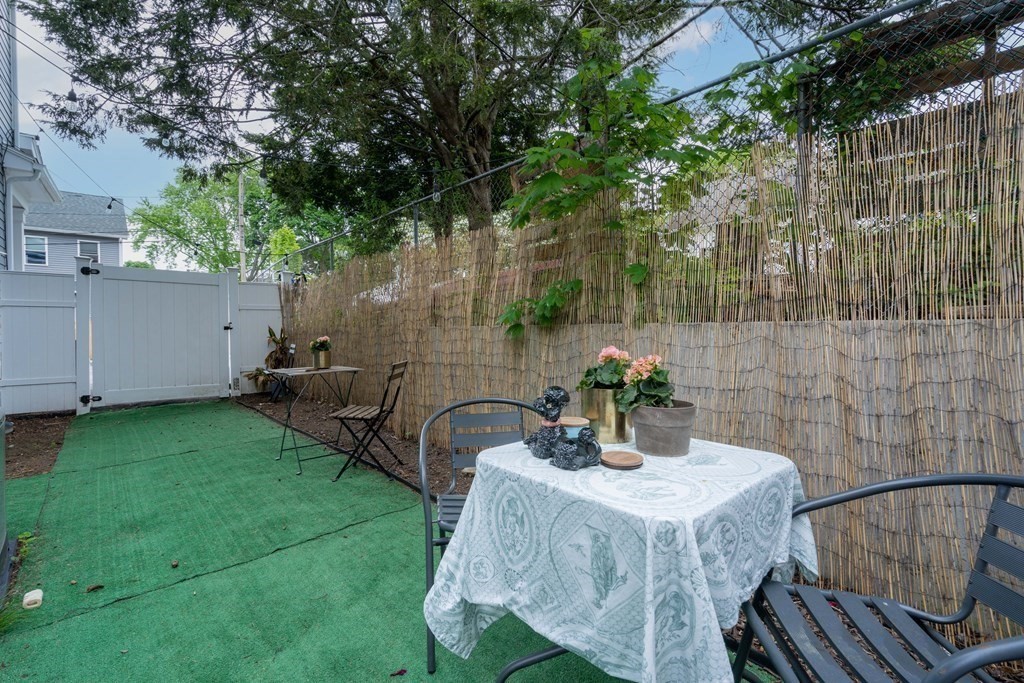8 Loring Place, Unit 8 Boston, MA 02136 - Photo 18 of 23 a view of a table and chairs in patio