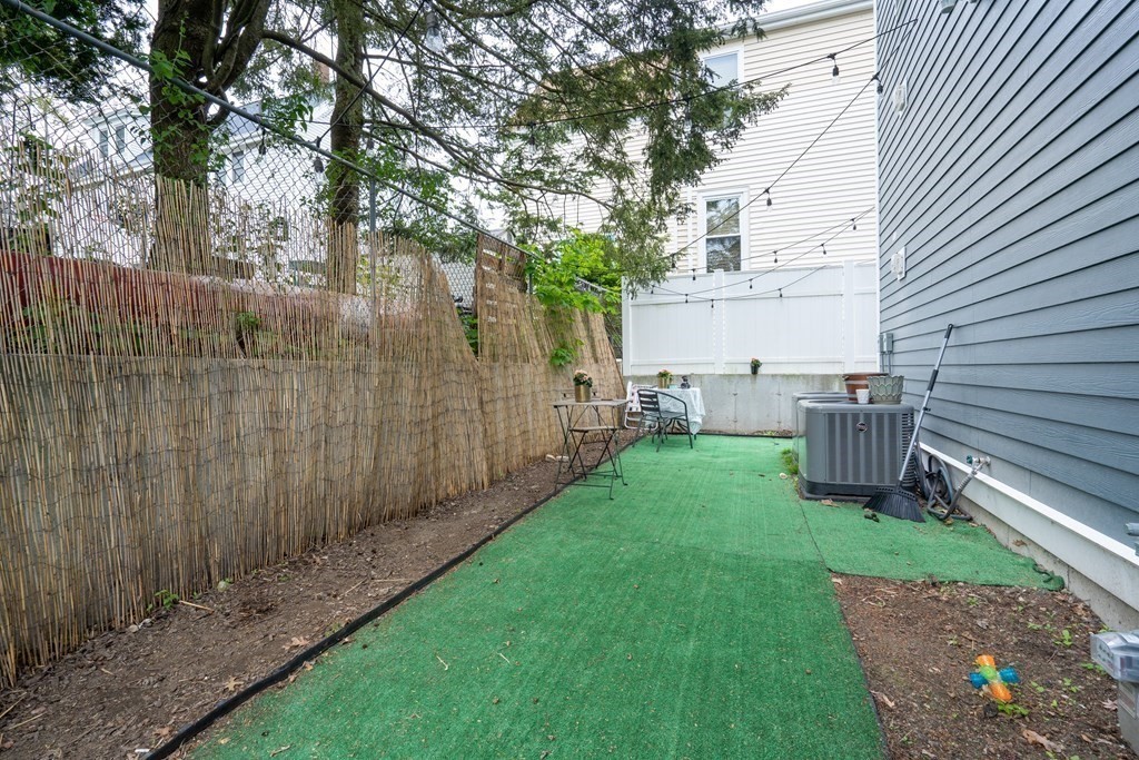8 Loring Place, Unit 8 Boston, MA 02136 - Photo 19 of 23 a view of a backyard with a garden