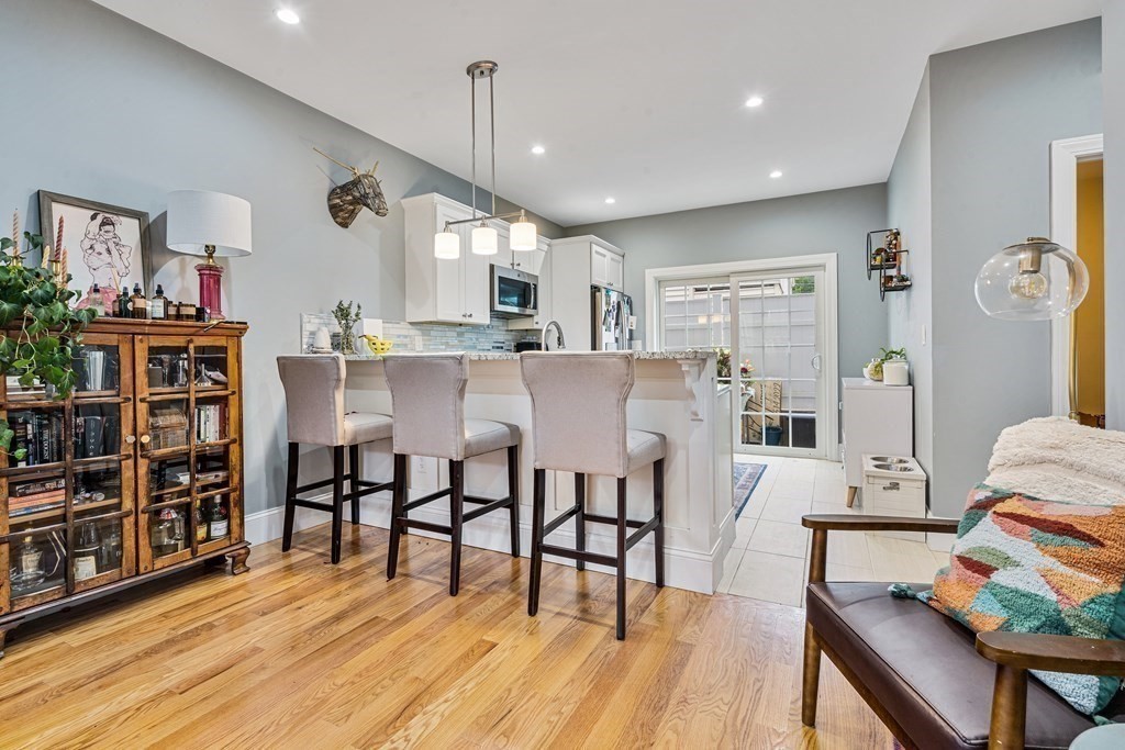 8 Loring Place, Unit 8 Boston, MA 02136 - Photo 7 of 23 a view of a dining room with furniture and wooden floor