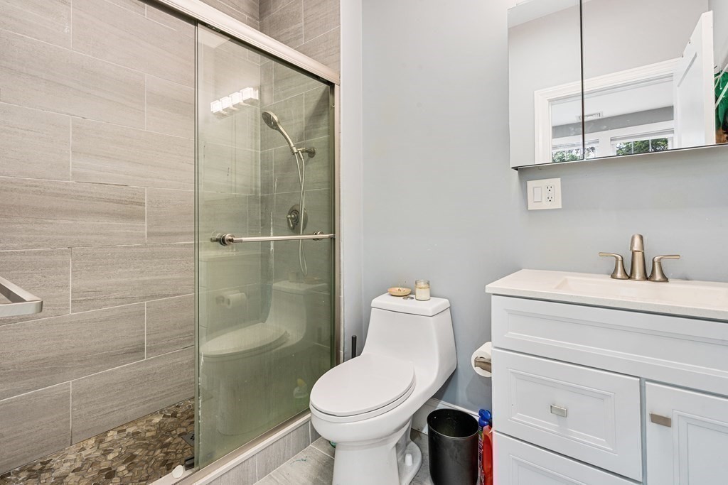 8 Loring Place, Unit 8 Boston, MA 02136 - Photo 10 of 23 a bathroom with a toilet sink and shower