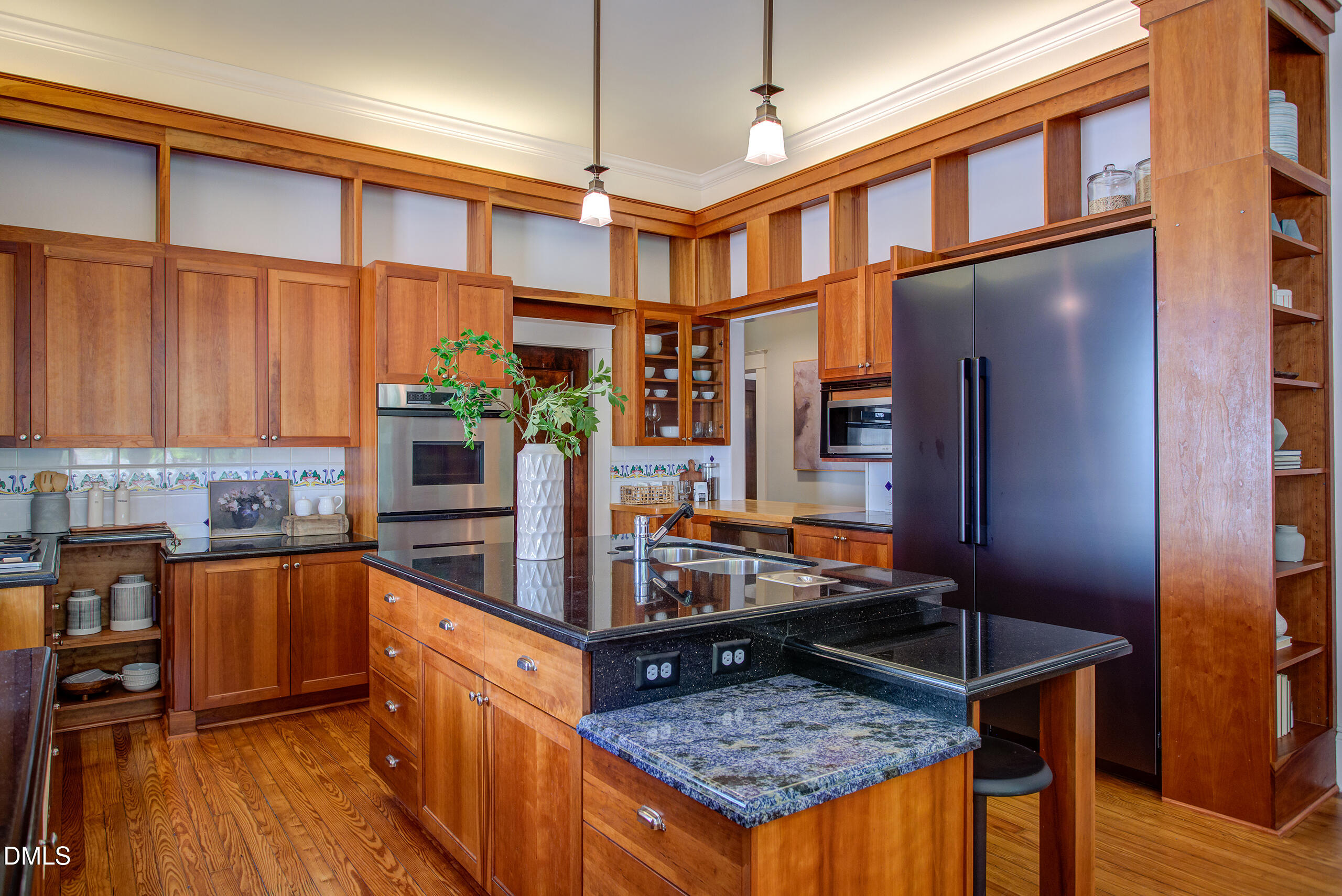 127 Forest Road Raleigh, NC 27605 - Photo 25 of 75 a kitchen with stainless steel appliances granite countertop a stove refrigerator and cabinets