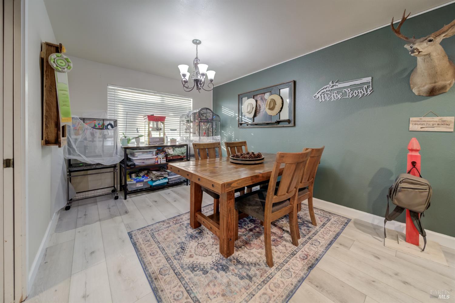 989 Suffolk Way Fairfield, CA 94533 - Photo 13 of 30 a view of a dining room with furniture and chandelier