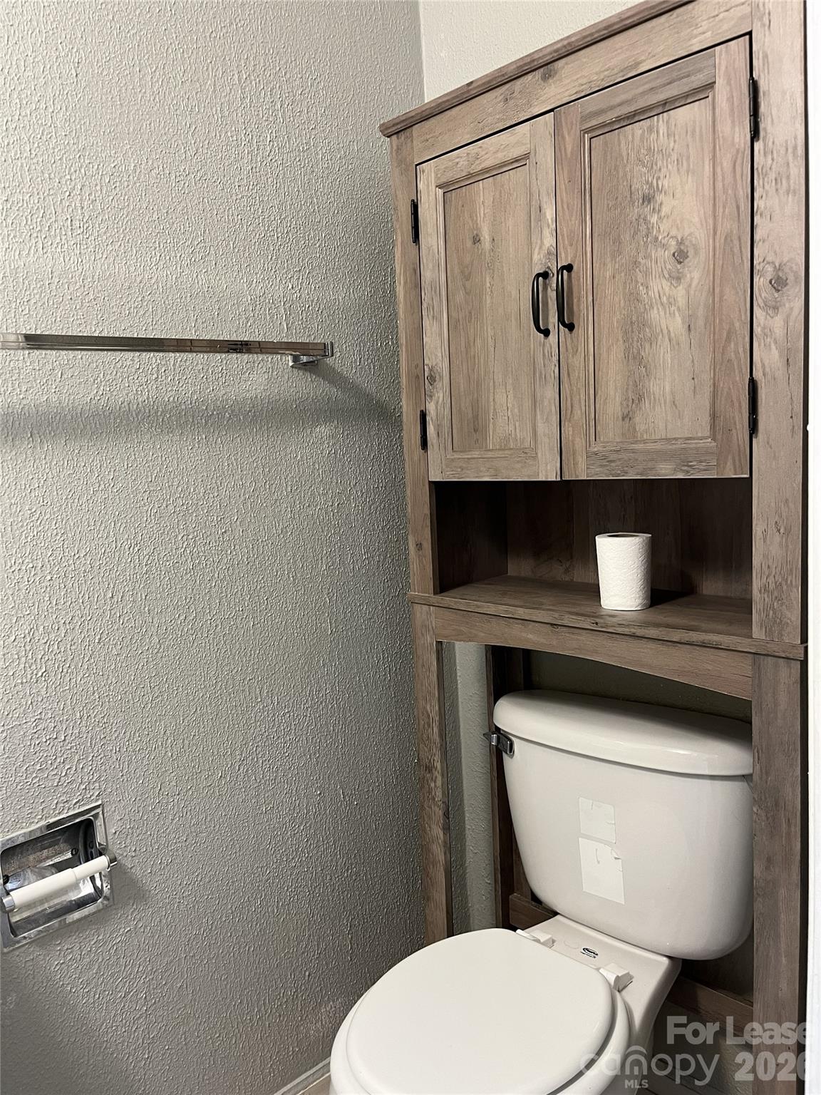 1911 Smoke Ridge Court, Unit 5 Charlotte, NC 28210 - Photo 8 of 16 a bathroom with a toilet and a shower