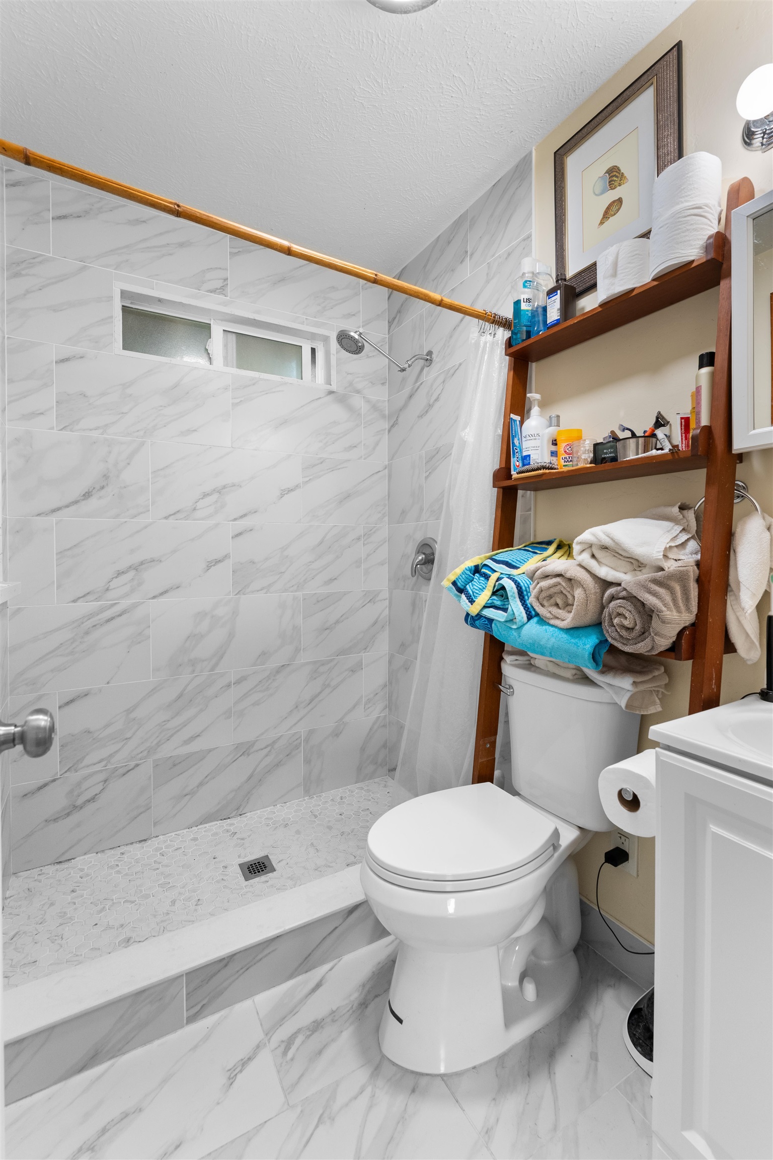 2115 Kaupakalua Road Haiku, HI 96708 - Photo 18 of 26 a white toilet sitting next to a bath tub shower