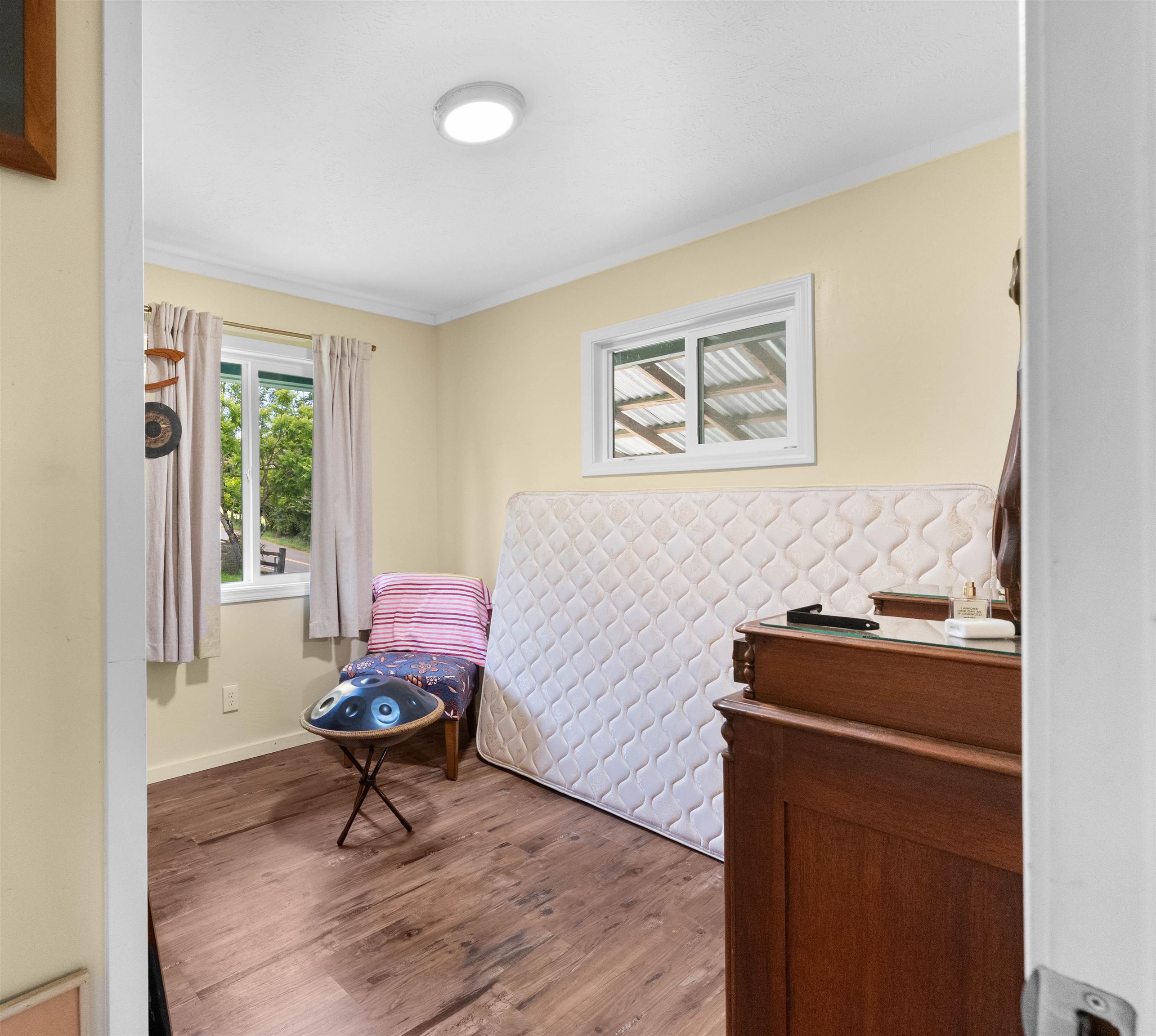 2115 Kaupakalua Road Haiku, HI 96708 - Photo 21 of 26 a living room with furniture and a window