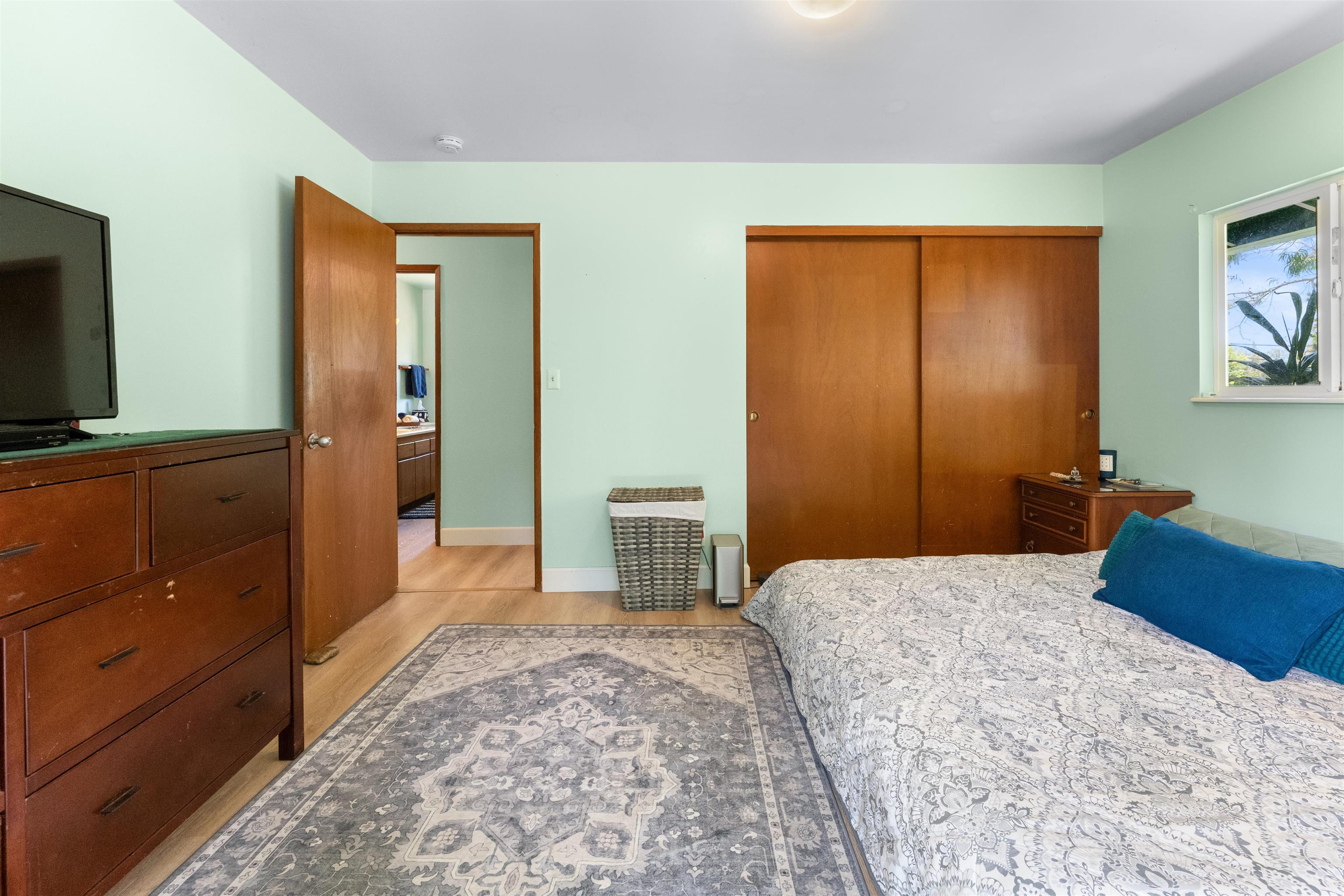 2115 Kaupakalua Road Haiku, HI 96708 - Photo 7 of 26 a bedroom with a bed and a dresser in it