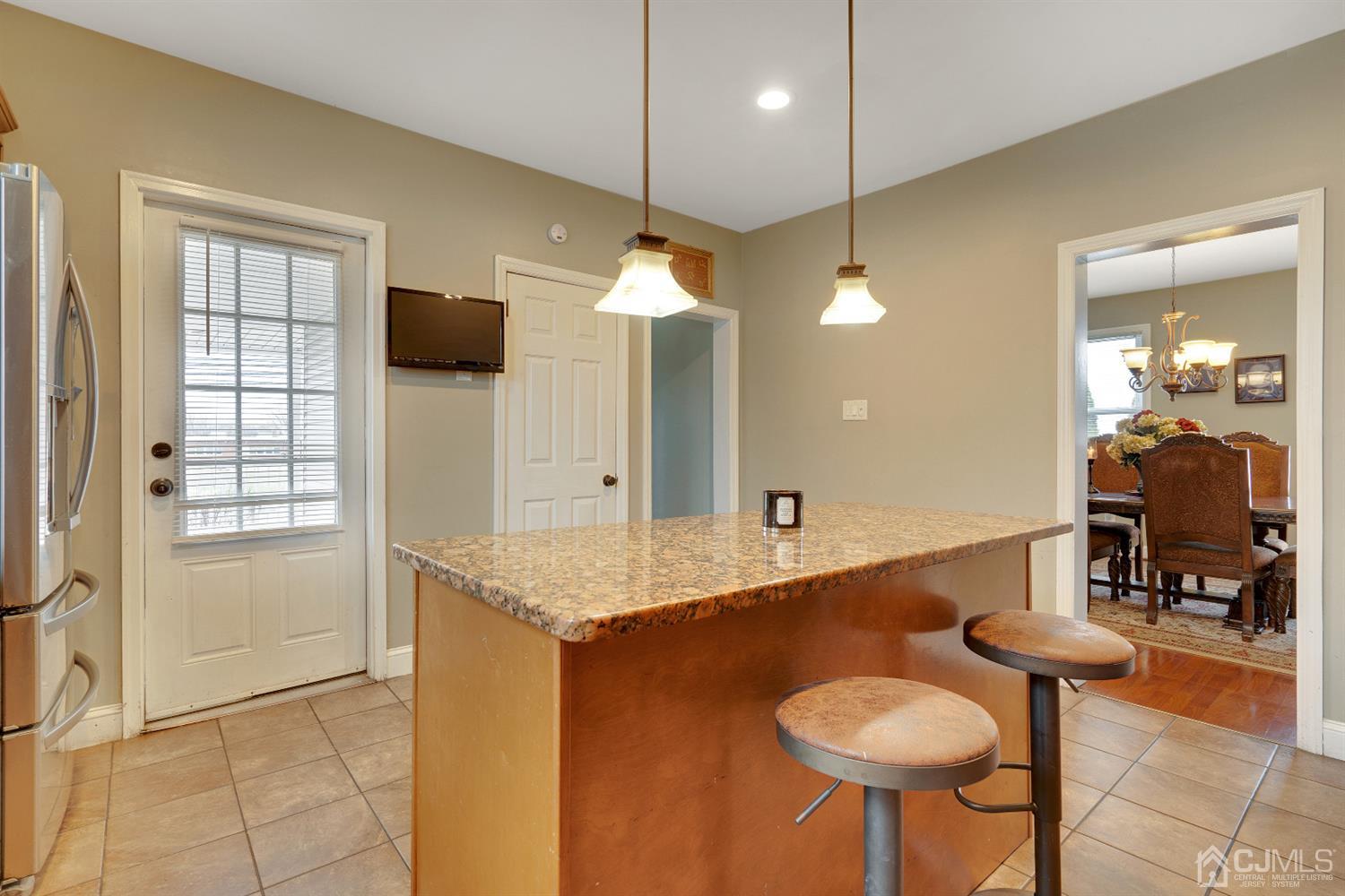 605 Beers Street Hazlet, NJ 07730 - Photo 13 of 32 a bathroom with a granite countertop sink and a mirror