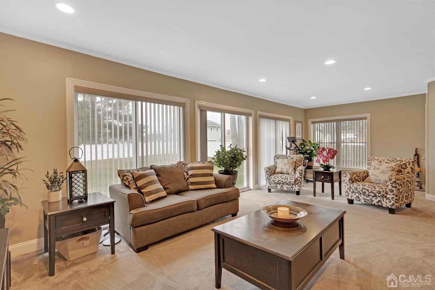 605 Beers Street Hazlet, NJ 07730 - Photo 14 of 32 a living room with furniture and a large window