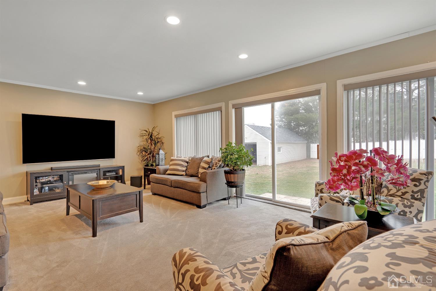 605 Beers Street Hazlet, NJ 07730 - Photo 15 of 32 a living room with furniture and a flat screen tv