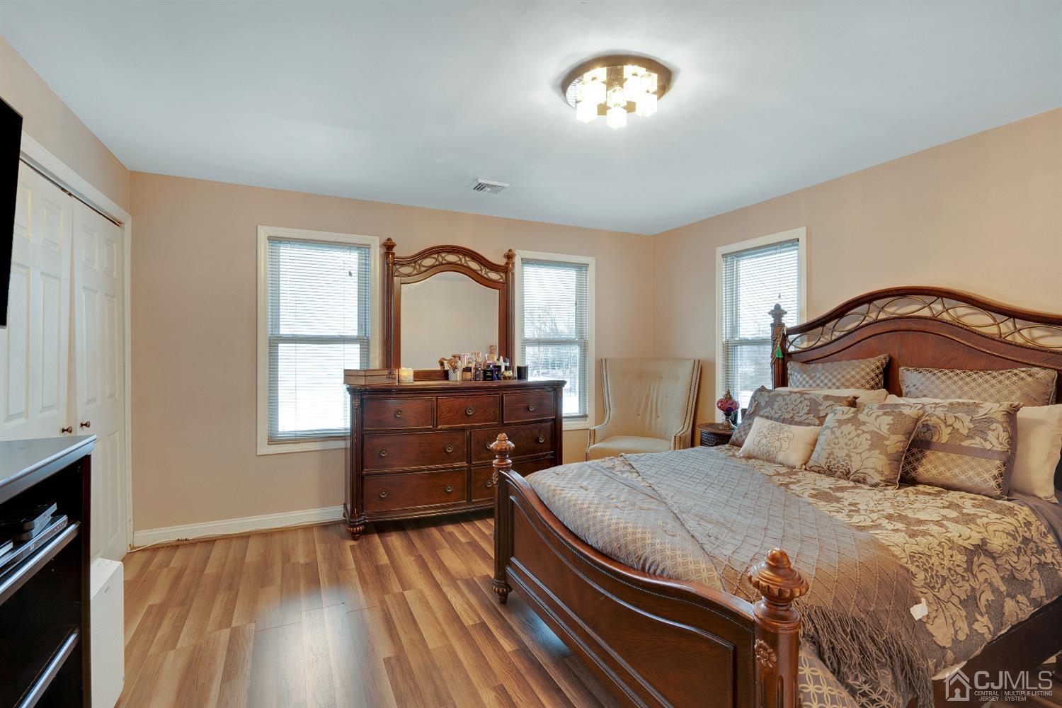 605 Beers Street Hazlet, NJ 07730 - Photo 17 of 32 a bedroom with a bed and a dresser