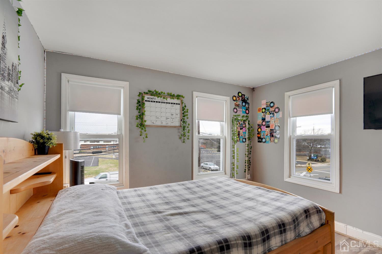 605 Beers Street Hazlet, NJ 07730 - Photo 18 of 32 a bedroom with a bed and a dresser with wooden floor