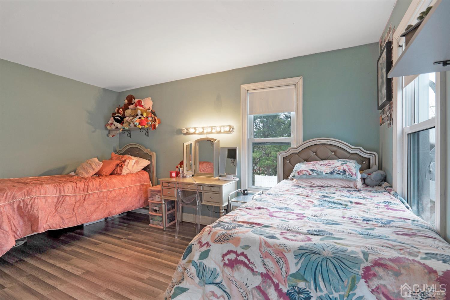 605 Beers Street Hazlet, NJ 07730 - Photo 20 of 32 a bedroom with a bed and wooden floor