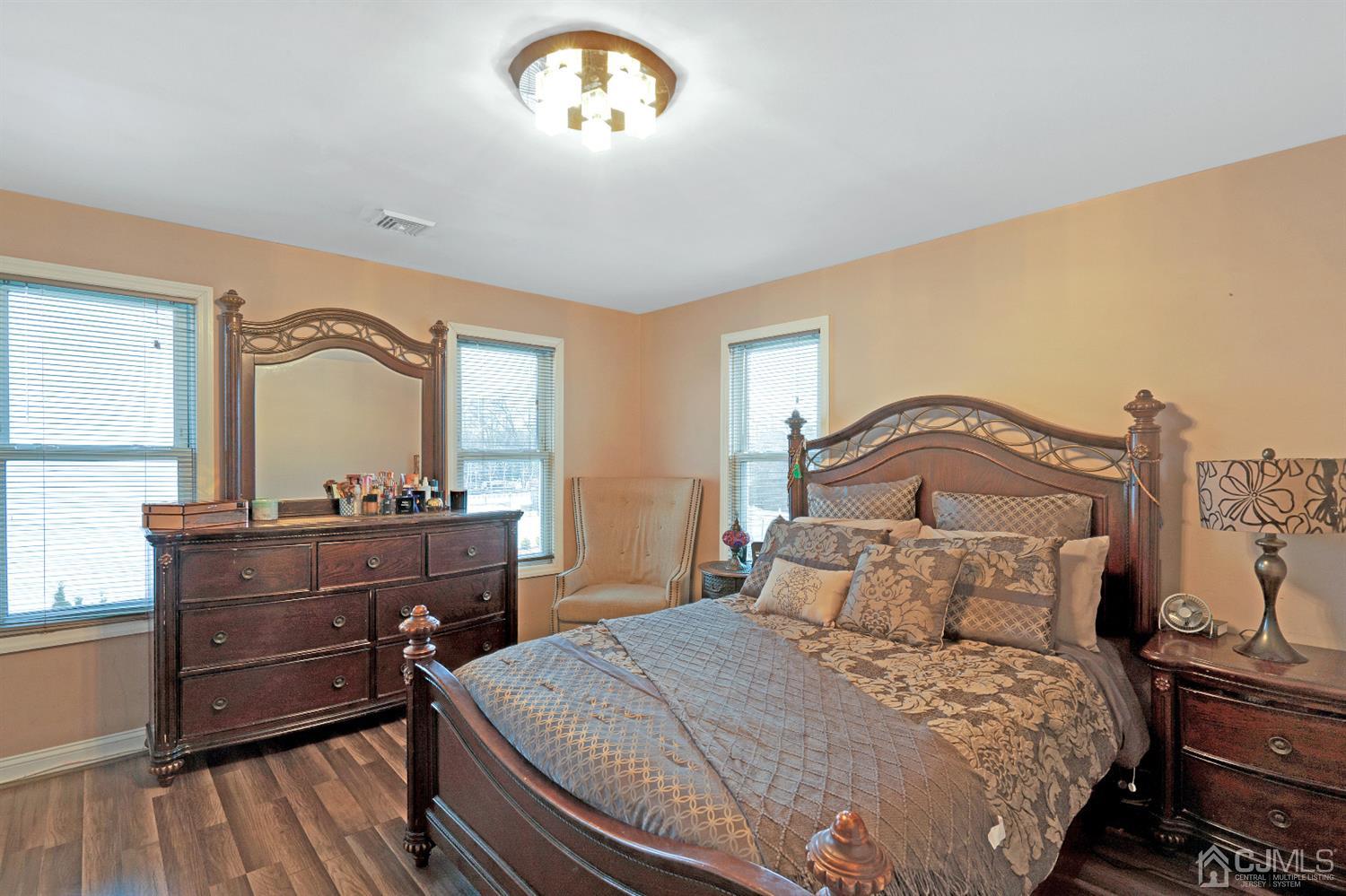 605 Beers Street Hazlet, NJ 07730 - Photo 22 of 32 a bedroom with a bed and a dresser