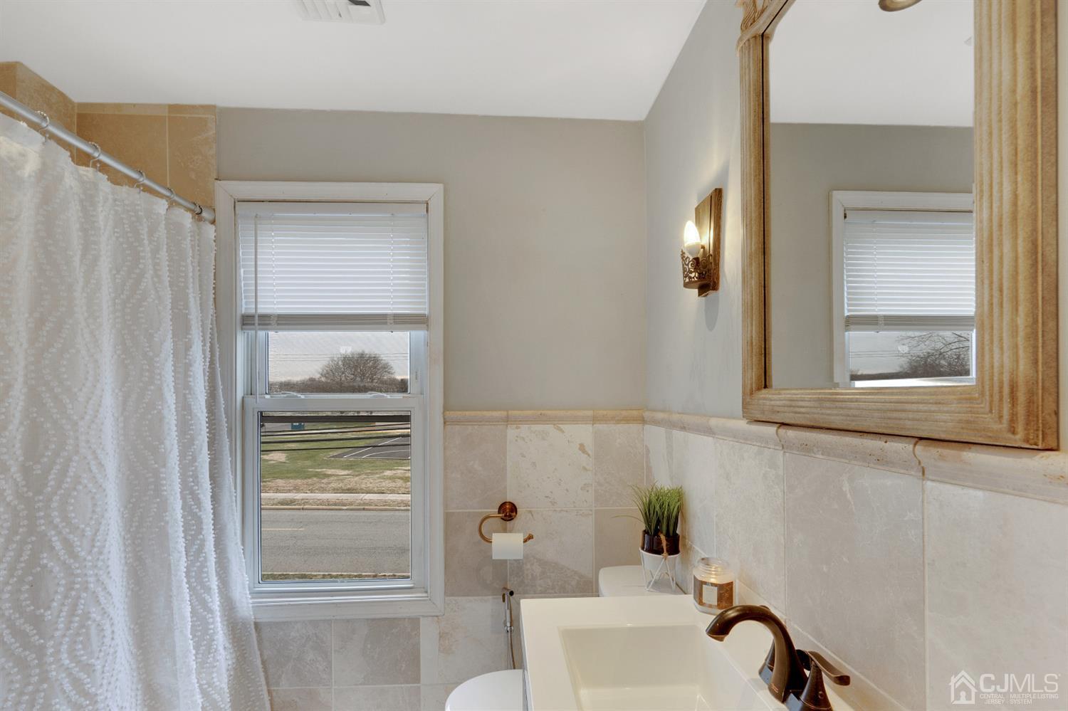 605 Beers Street Hazlet, NJ 07730 - Photo 24 of 32 a bathroom with a bathtub and shower
