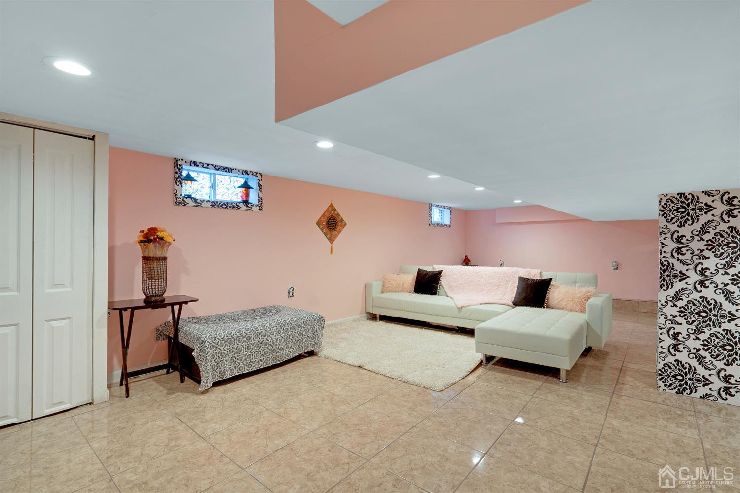 605 Beers Street Hazlet, NJ 07730 - Photo 25 of 32 a living room with furniture and painting on the wall