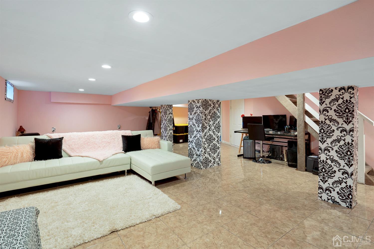 605 Beers Street Hazlet, NJ 07730 - Photo 26 of 32 a living room with furniture and a flat screen tv