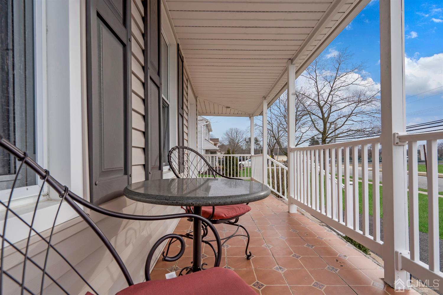 605 Beers Street Hazlet, NJ 07730 - Photo 30 of 32 a table and chairs in the balcony