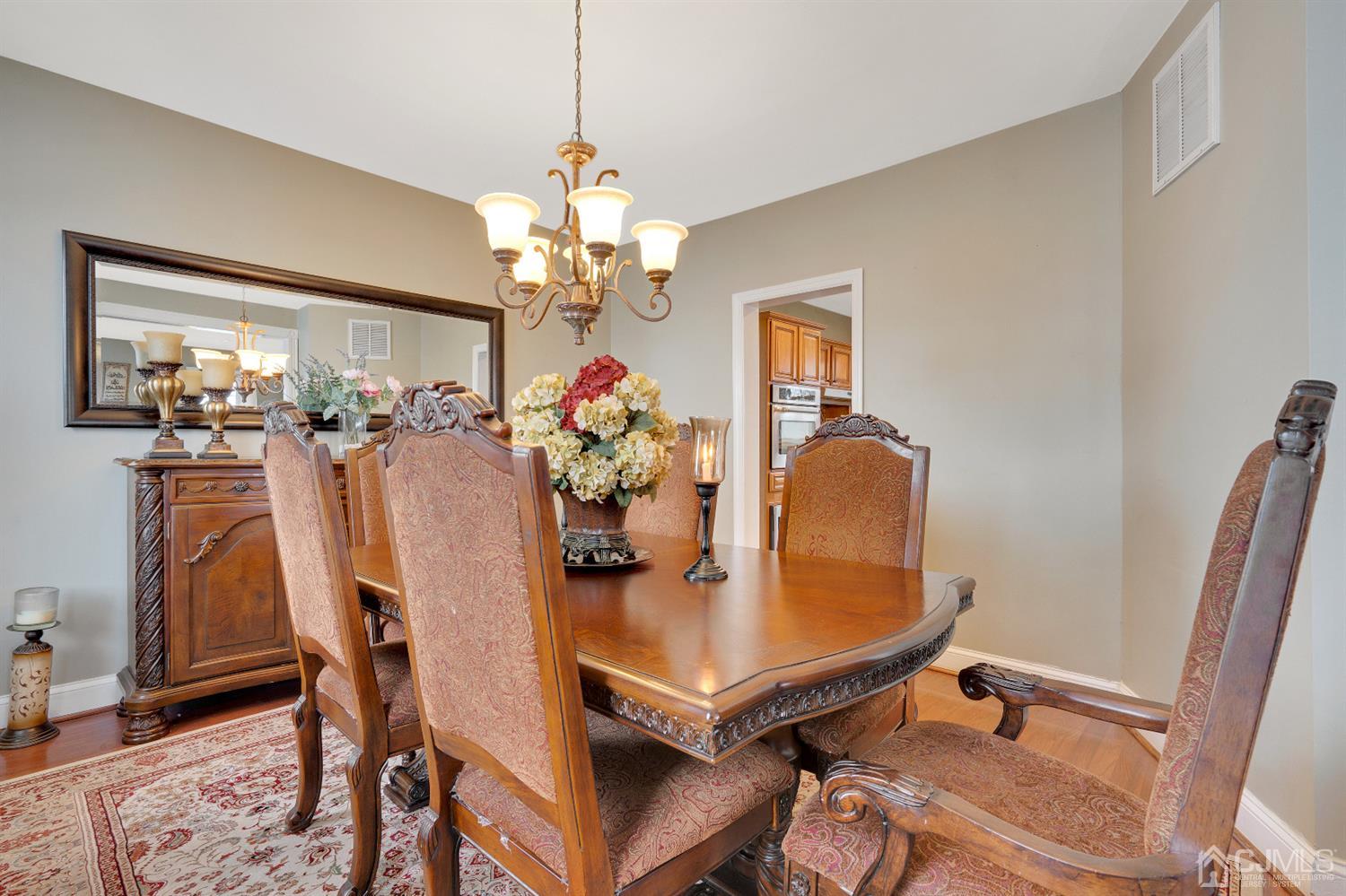 605 Beers Street Hazlet, NJ 07730 - Photo 8 of 32 a dining room with furniture and chandelier