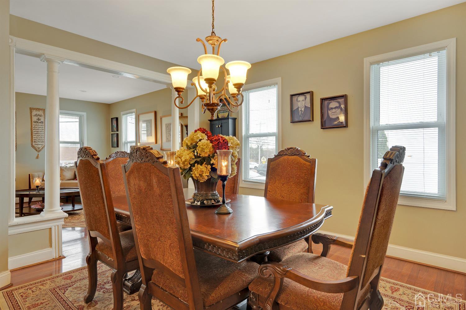 605 Beers Street Hazlet, NJ 07730 - Photo 9 of 32 a view of a dining room with furniture and a chandelier