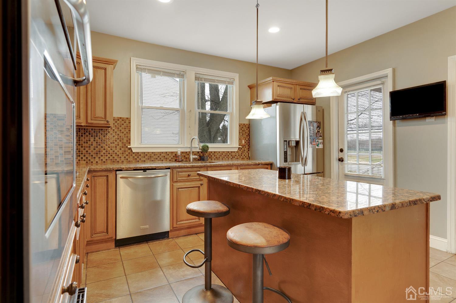 605 Beers Street Hazlet, NJ 07730 - Photo 10 of 32 a kitchen with stainless steel appliances granite countertop a sink and a refrigerator