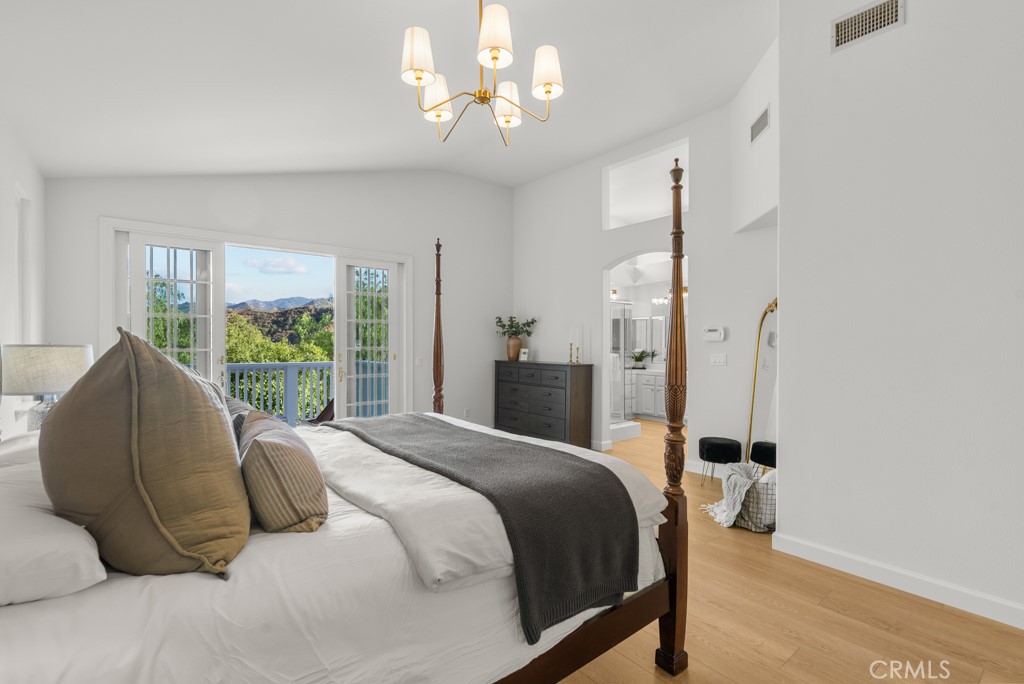 25930 Franklin Lane Stevenson Ranch, CA 91381 - Photo 20 of 47 a bedroom with a bed mirror and window