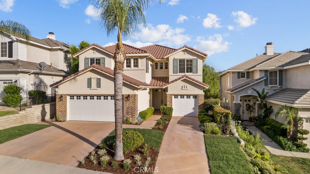 25930 Franklin Lane Stevenson Ranch, CA 91381 - Photo 2 of 47 a front view of a houses with yard