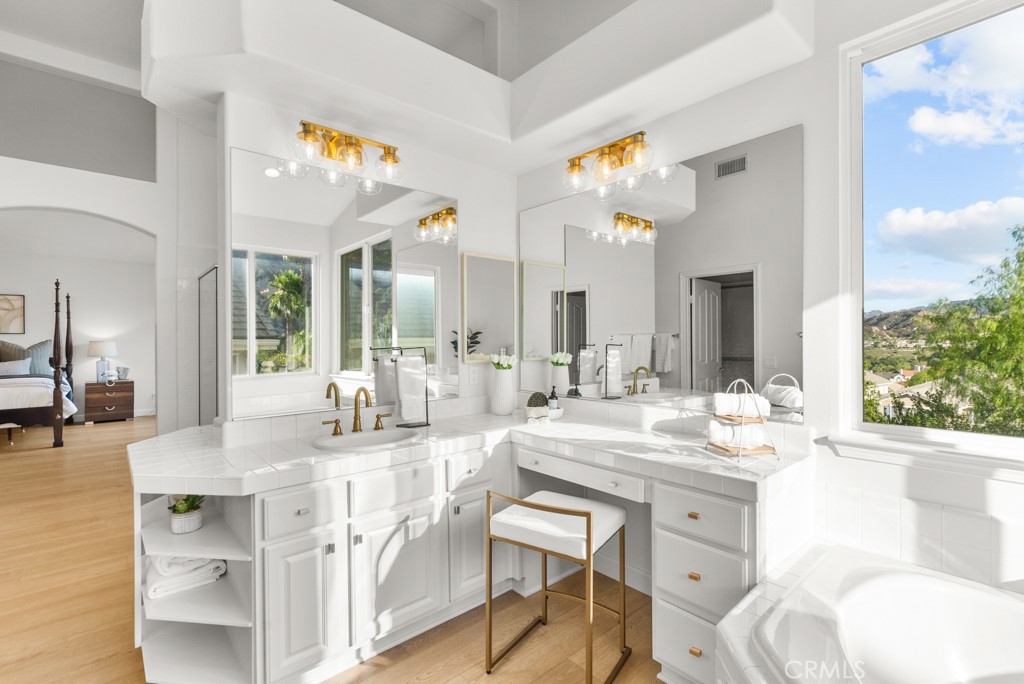 25930 Franklin Lane Stevenson Ranch, CA 91381 - Photo 27 of 47 a dining hall with stainless steel appliances kitchen island granite countertop a sink and chairs