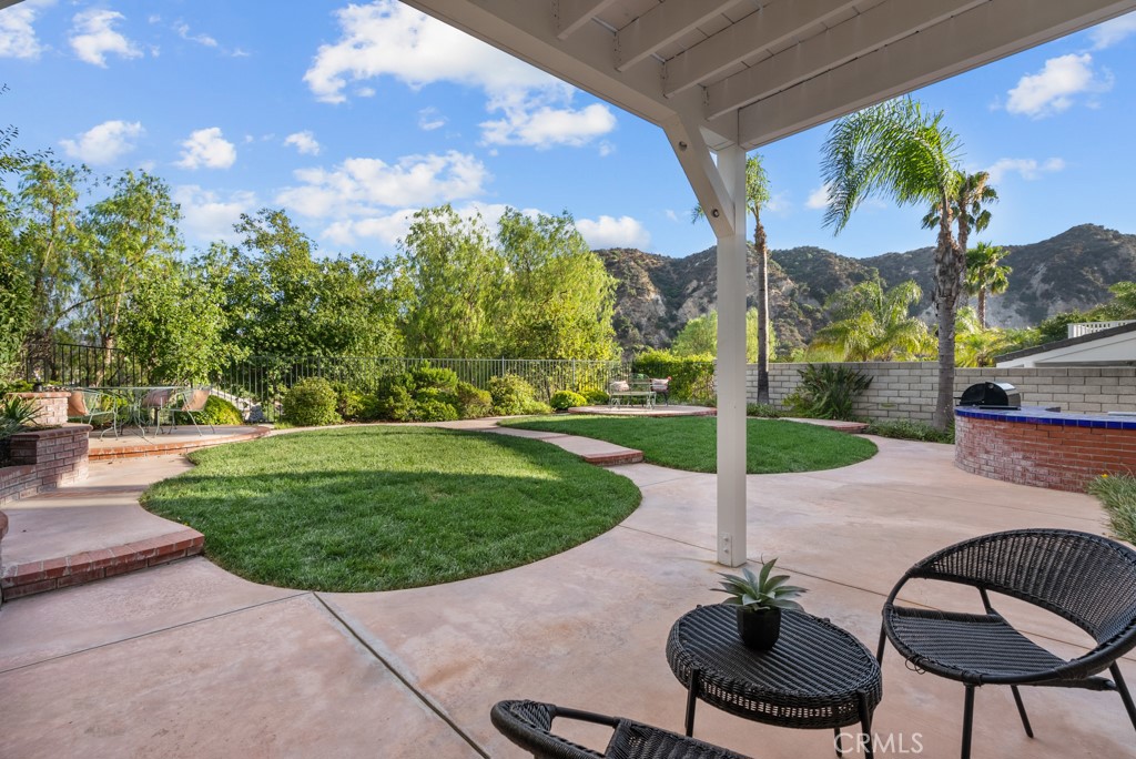 25930 Franklin Lane Stevenson Ranch, CA 91381 - Photo 36 of 47 a backyard of a house with table and chairs