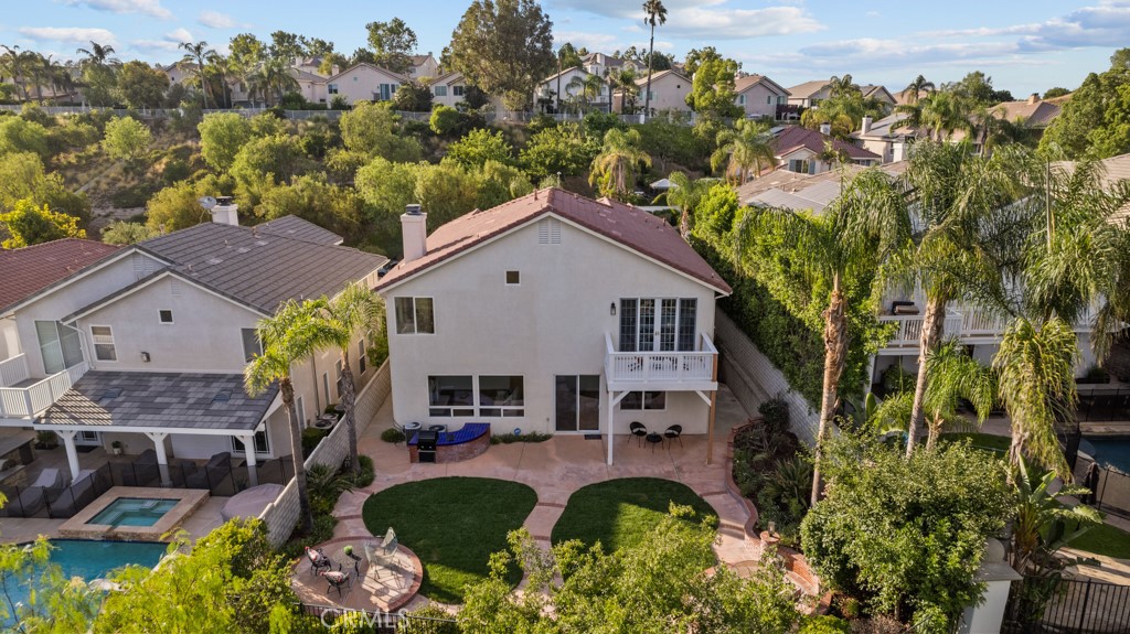 25930 Franklin Lane Stevenson Ranch, CA 91381 - Photo 39 of 47 a aerial view of a house with swimming pool and a yard