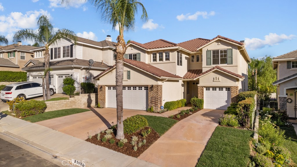 25930 Franklin Lane Stevenson Ranch, CA 91381 - Photo 42 of 47 a front view of a house with a garden and plants