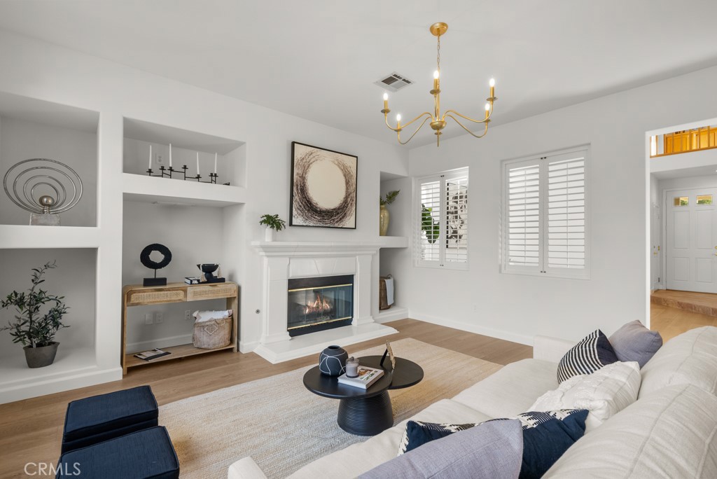 25930 Franklin Lane Stevenson Ranch, CA 91381 - Photo 6 of 47 a living room with furniture a fireplace and a window