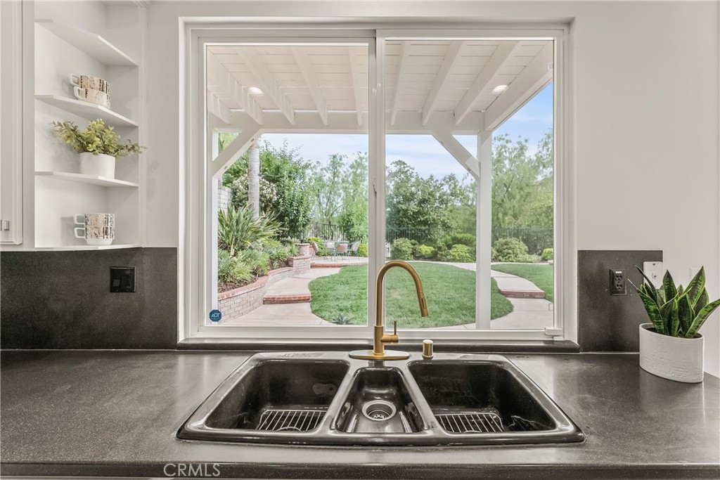 25930 Franklin Lane Stevenson Ranch, CA 91381 - Photo 10 of 47 a view of a sink a table and a potted plant