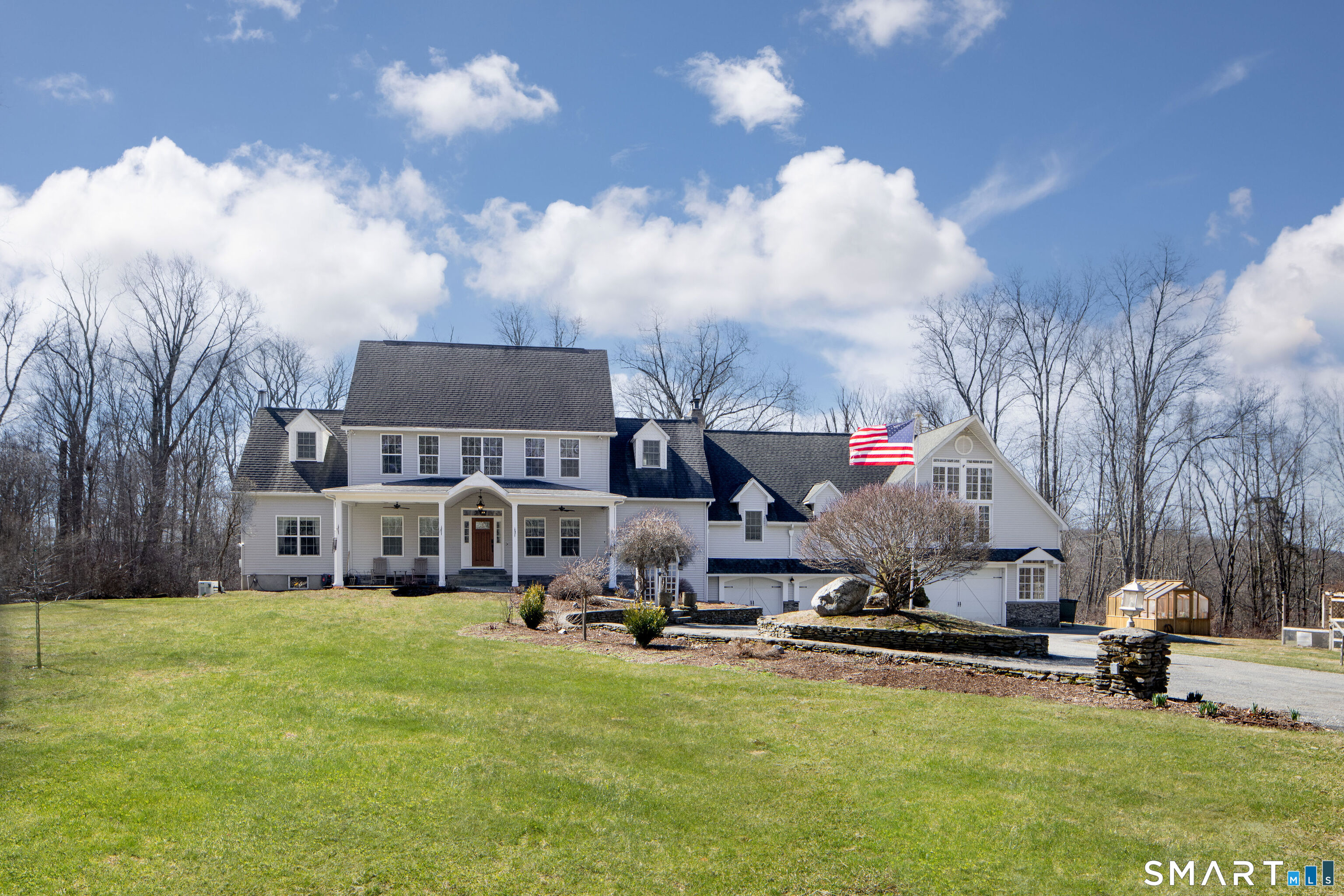 Set back down the end of a pretty driveway sits this wonderful home on 3.7 beautiful acres.