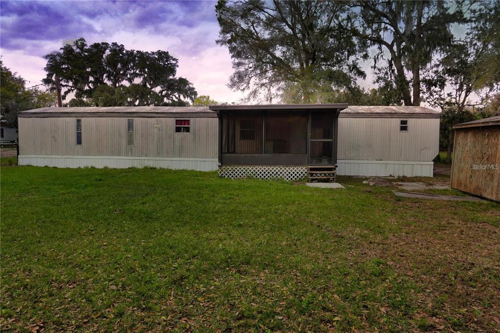 7230 James Stanaland Road Plant City, FL 33567 - Photo 5 of 26 a view of a house with a yard