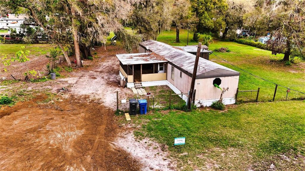 7230 James Stanaland Road Plant City, FL 33567 - Photo 6 of 26 an aerial view of a house with garden space and lake view