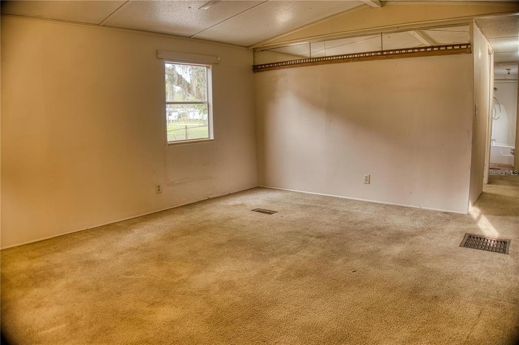 7230 James Stanaland Road Plant City, FL 33567 - Photo 7 of 26 a view of an empty room with a window