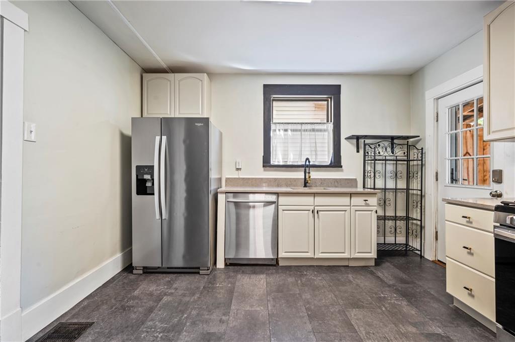 730 6th Avenue Coraopolis, PA 15108 - Photo 15 of 37 Trendy off white cabinets with stunning hardware, undermount sink, appliances and granite counter tops