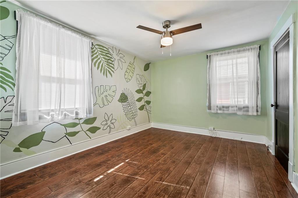 730 6th Avenue Coraopolis, PA 15108 - Photo 23 of 37 Second bedroom has beautiful floors and unique painted wall