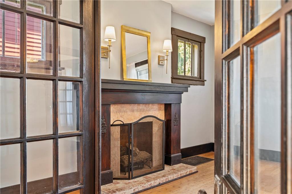 730 6th Avenue Coraopolis, PA 15108 - Photo 7 of 37 Beautiful French doors in living room . The focal point is the fireplace with side windows