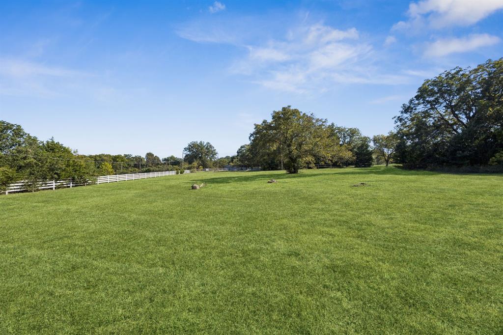 6 North Star Road Lucas, TX 75002 - Photo 6 of 12 a view of a green field with wooden fence