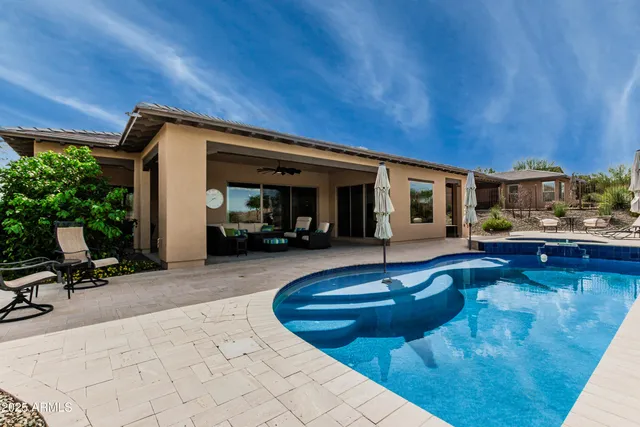 a view of a big room with furniture and chandelier