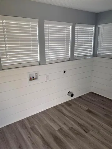 a bathroom with a bathtub and window