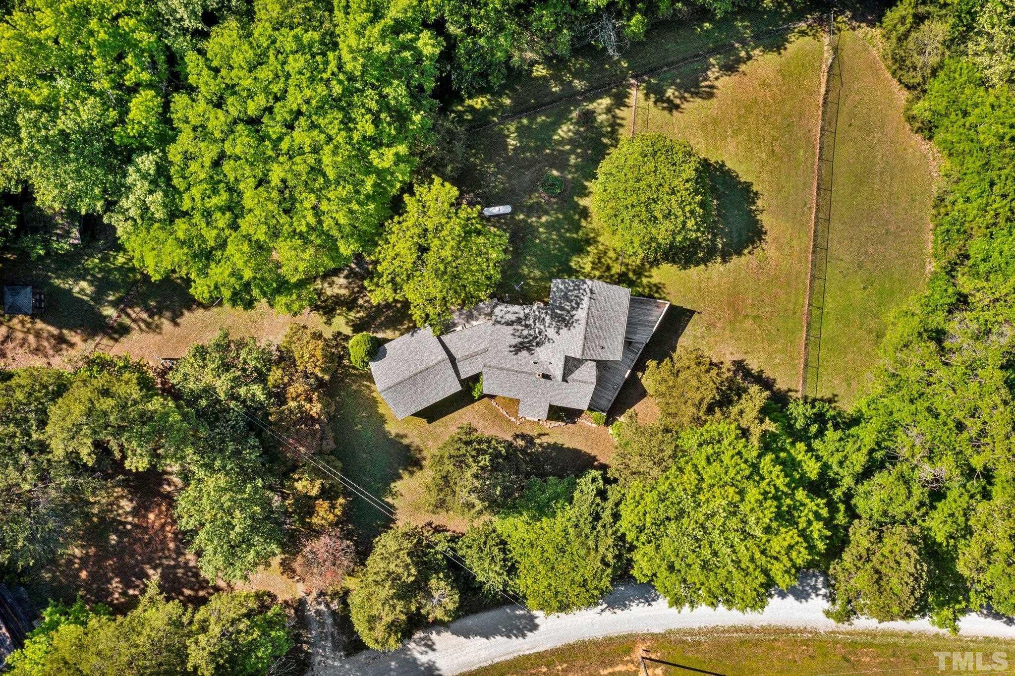 225 Huff Garrett Road Roxboro, NC 27574 - Photo 31 of 38 an aerial view of a house with a yard basket ball court