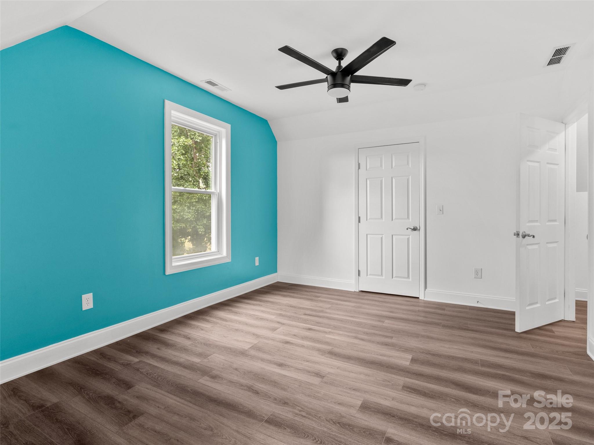 99 Curtis Parker Road Alexander, NC 28701 - Photo 13 of 24 wooden floor in an empty room with a window