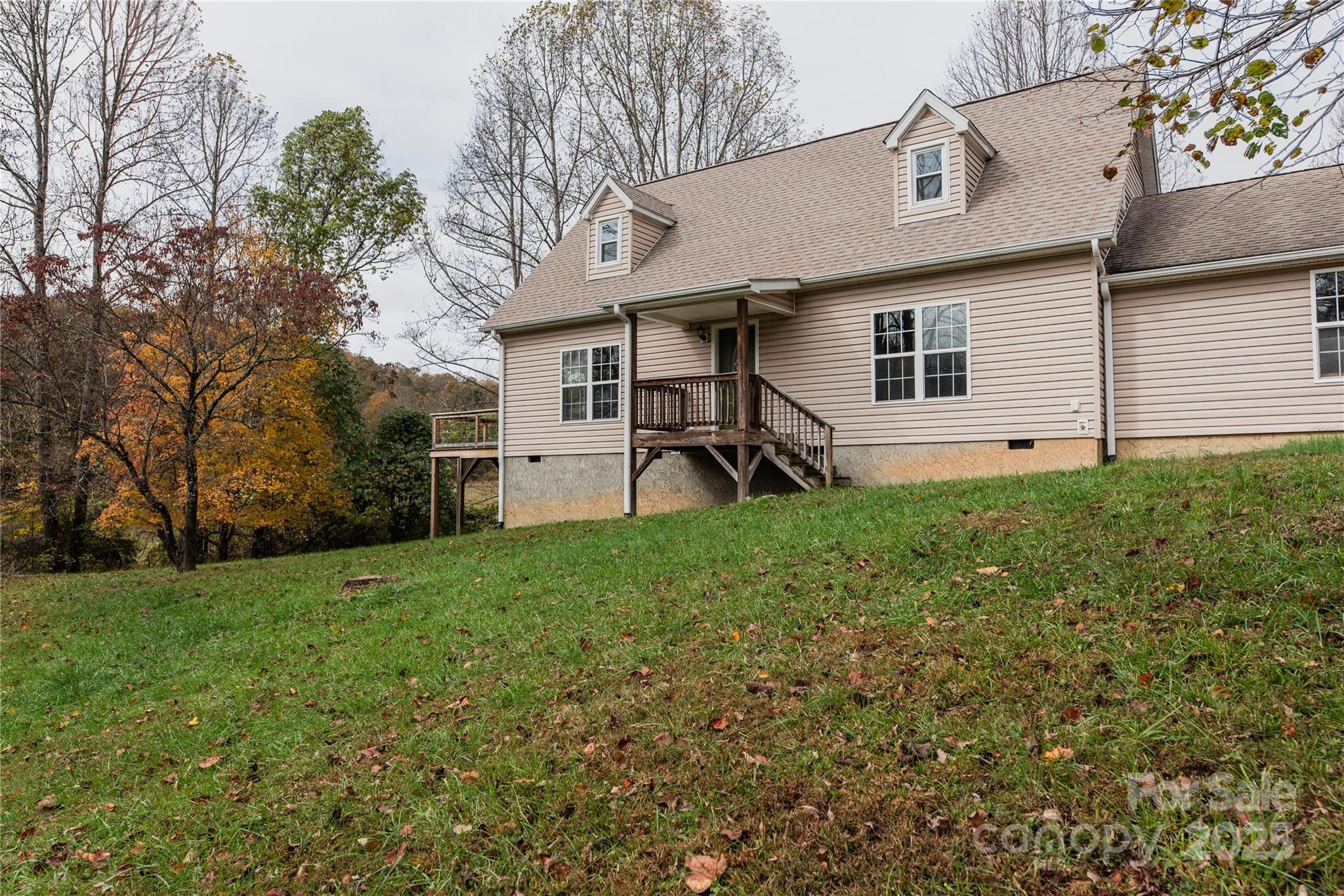 99 Curtis Parker Road Alexander, NC 28701 - Photo 2 of 24 a view of a backyard of the house