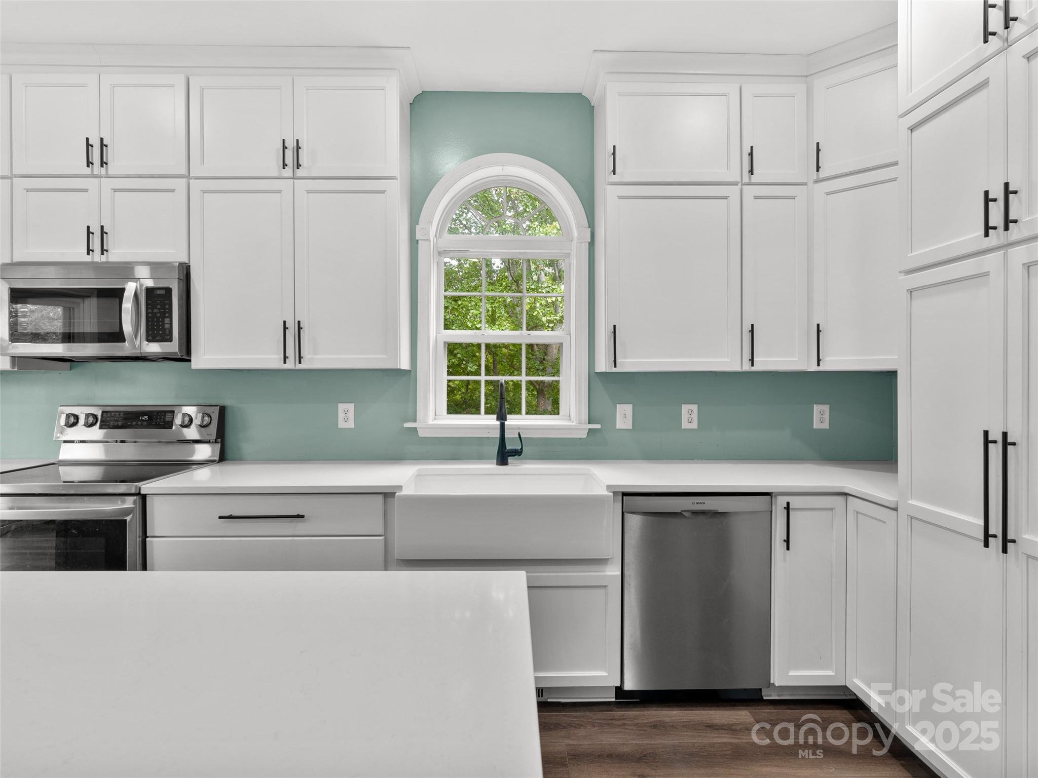 99 Curtis Parker Road Alexander, NC 28701 - Photo 7 of 24 a kitchen with cabinets appliances and a sink