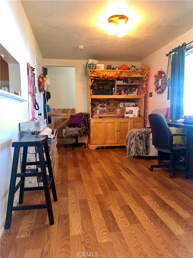 20320 Roads End Drive Perris, CA 92570 - Photo 11 of 21 a living room with furniture a flat screen tv and gym equipment