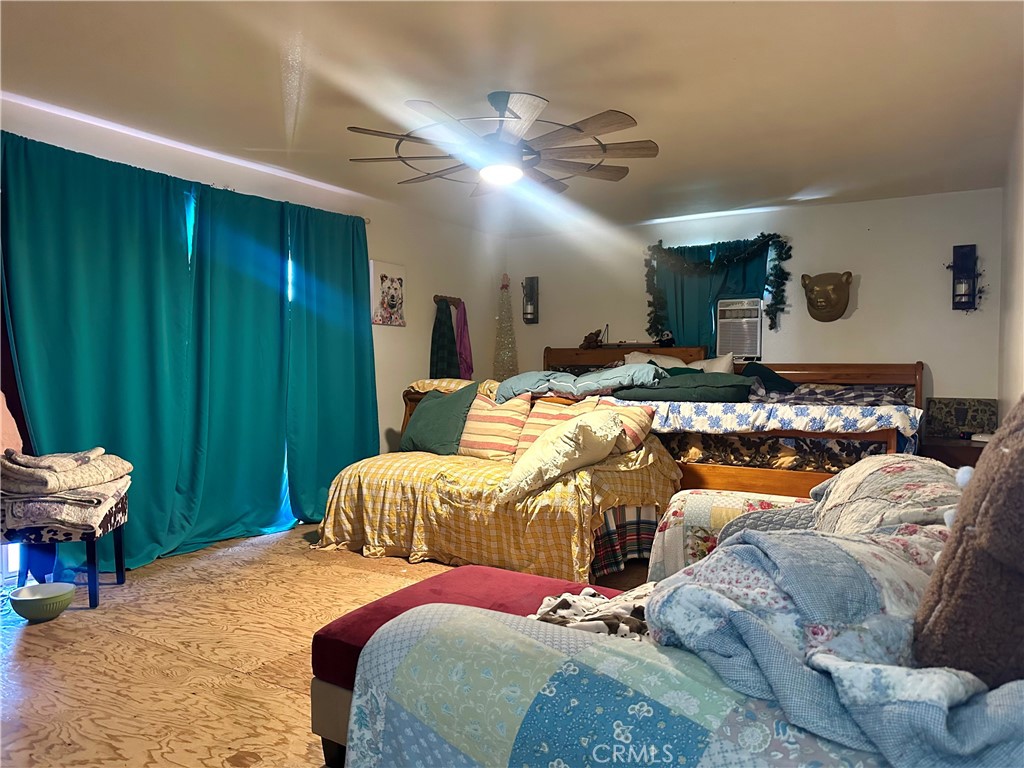 20320 Roads End Drive Perris, CA 92570 - Photo 13 of 21 a bedroom with a bed and a mirror