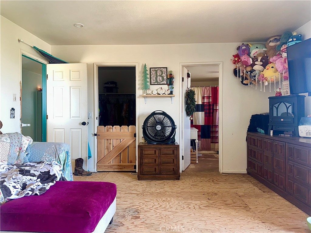 20320 Roads End Drive Perris, CA 92570 - Photo 14 of 21 a living room with furniture and a dresser
